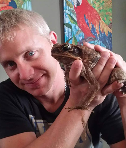 Man holding a large toad